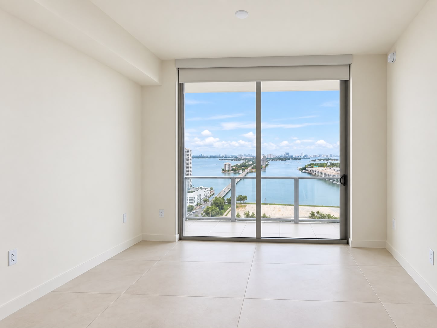 Bedroom with floor-to-ceiling bay view