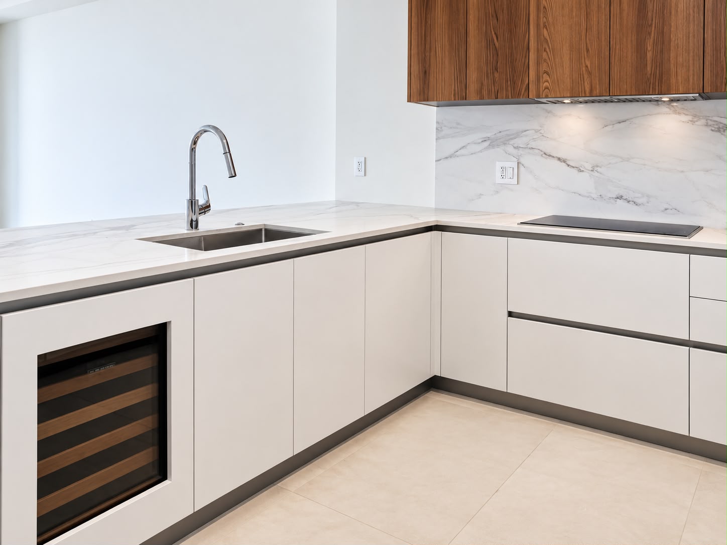 Kitchen with wine refrigeration and stone counters