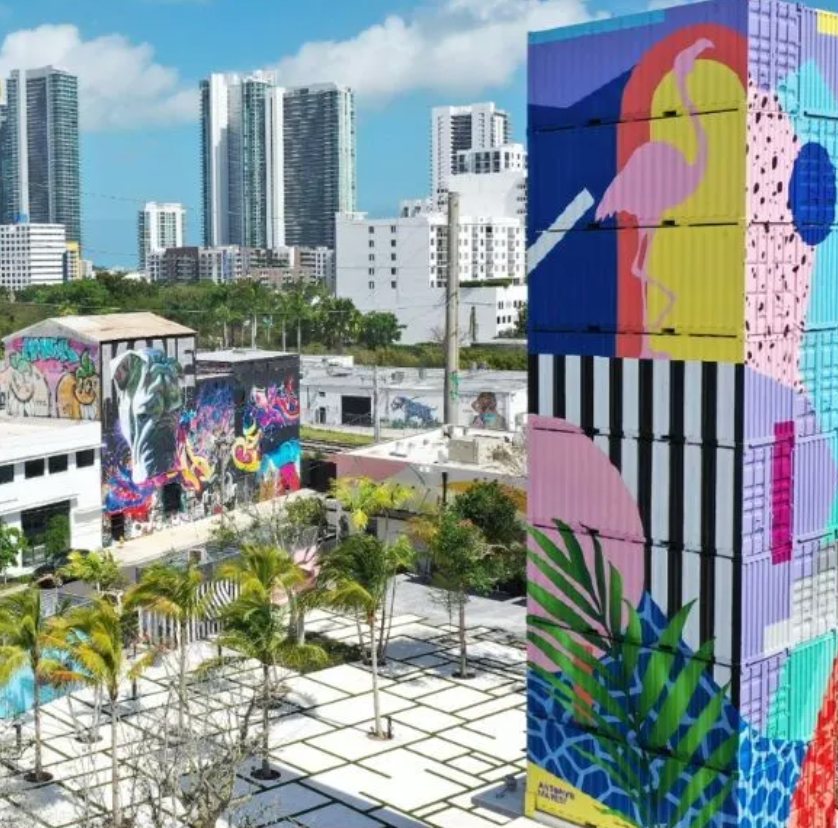 Wynwood murals and low-rise streetscape with the Miami skyline behind